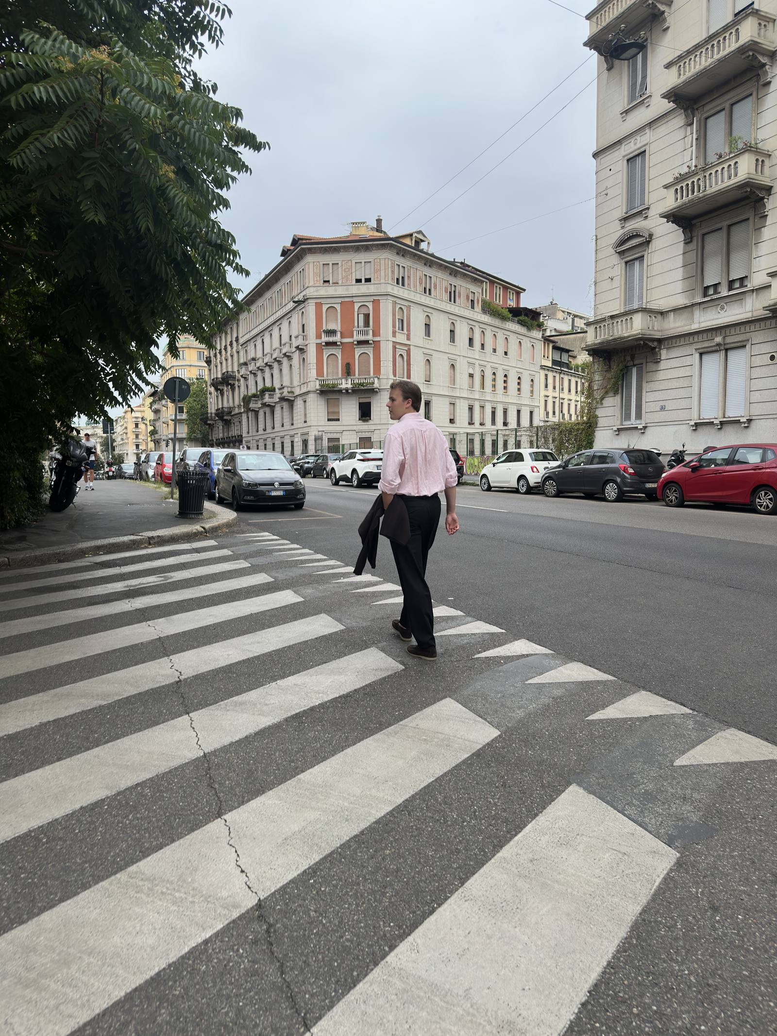 Miikka Koponen crossing a city street